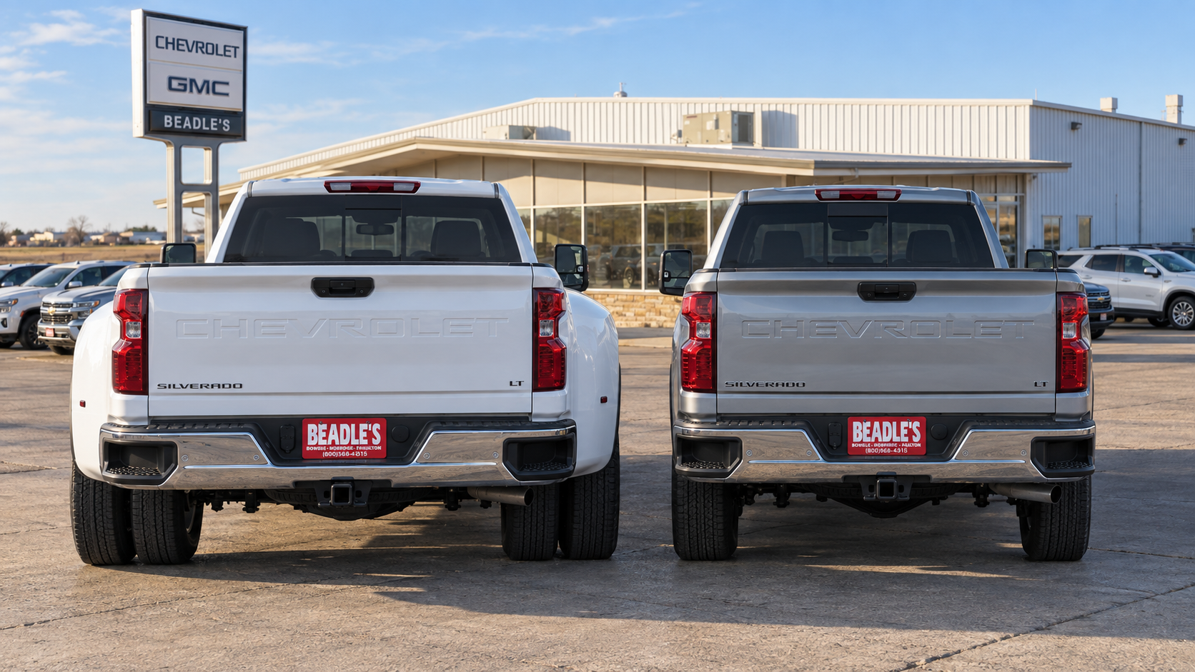 Silverado 3500 HD dually and single-rear-wheel trucks side by side at Beadle Chevrolet GMC in Mobridge