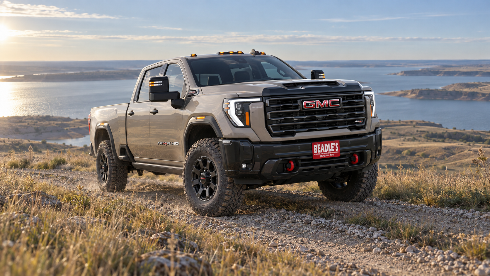 2027 GMC Sierra 2500 HD AT4X in Coastal Dune parked on a bluff above Lake Oahe near Mobridge, South Dakota